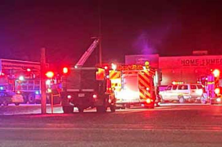 Fire crews respond to the fire at Home Lumber Dec. 6. In addition to Ellsworth, cire crews from Kanopolis, Holyrood and Wilson responded. ANDREW HIPP/Ellsworth County Independent-Reporter