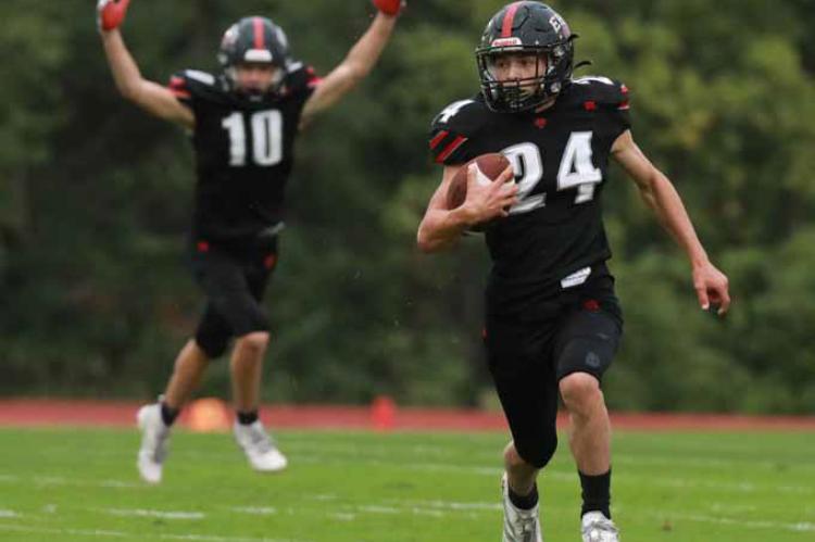 Ellsworth’s Jackson Minear (42) returns a punt during the first half of the Sept. 5 football game against the Sacred Heart Knights. Photos by KAREN BONAR/Ellsworth County Independent-Reporter