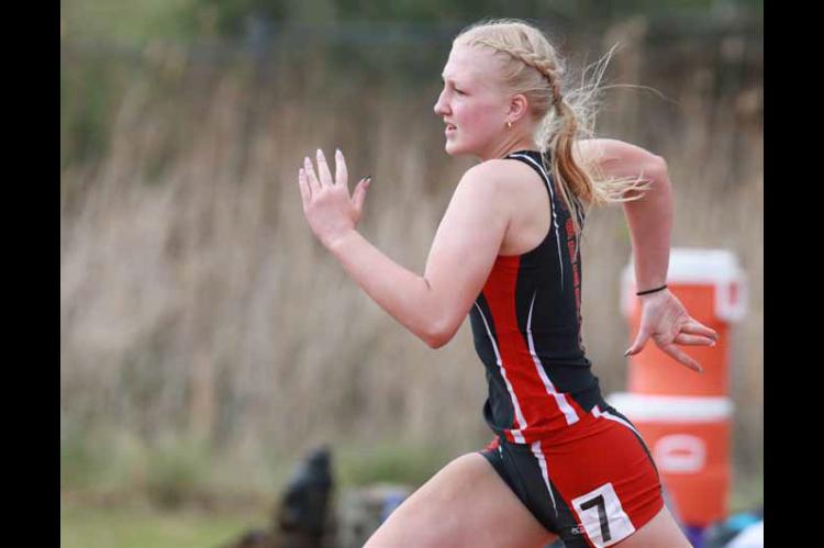 Ali Mikulecky competes in the 200-meter dash at the Ellsworth home track meet April 14. The girls’ team placed second. KAREN BONAR/Ellsworth County Independent-Reporter