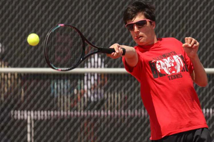 Seth Kyler competes in No. 1 doubles during the April 8 home tennis meet. KAREN BONAR/Ellsworth County Independent-Reporter