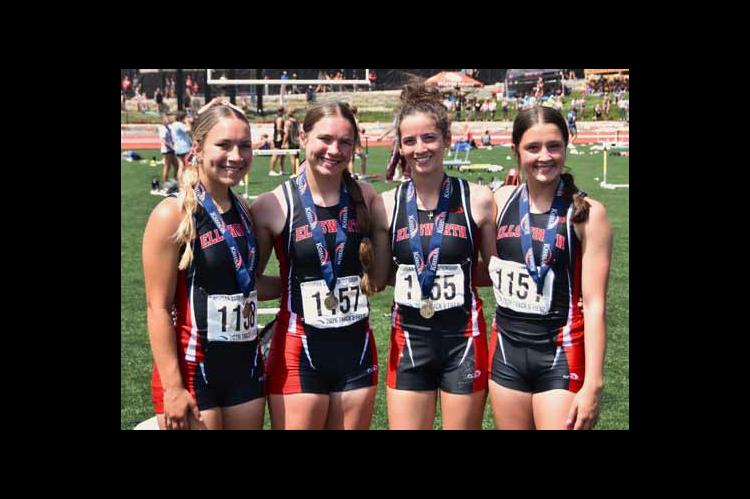 The girls’ 4x100-meter relay team of, from left, Kinly Place, Kari Place, Lainey Peschka and Kathryn Buggeln, celebrate a fifth place finish. The team also set a new school record for the race. Photos by jeremy obermeyer/Ellsworth County Independent-Reporter