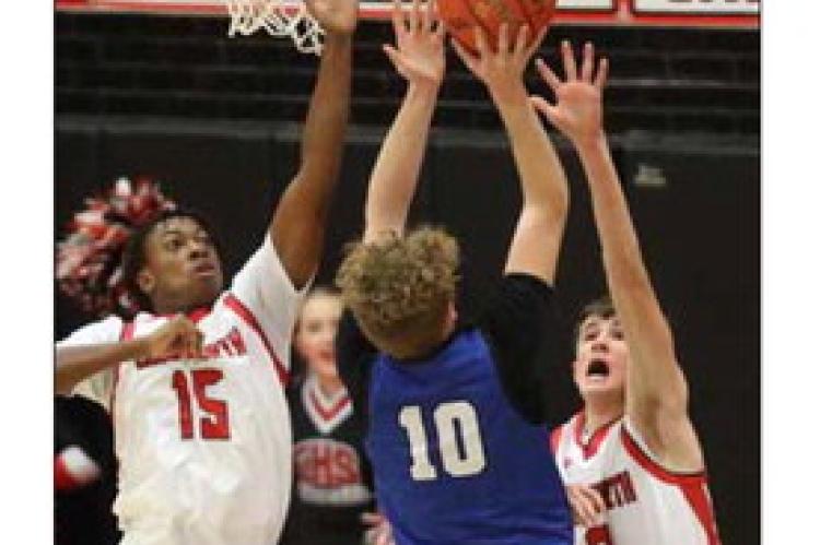 Ellsworth’s Cooper McGowan (15) and Jace Thomasson (2) attempt to block a shot from Lyons’ Tegan Link (10) during the Dec. 6 season home opener. KAREN BONAR/Ellsworth County Independent-Reporter