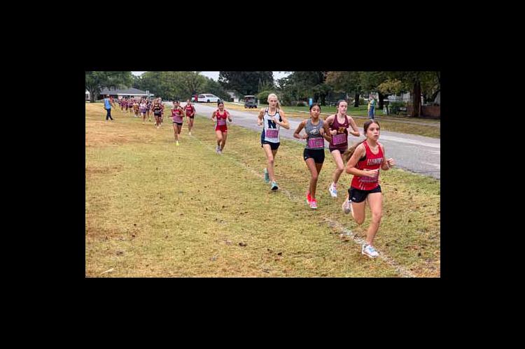 Freshman Mazie Barta leads the pack at the Hesston Invitational Sept. 10. She set a PR during the race. ERIC COONROD/Ellsworth County Independent-Reporter