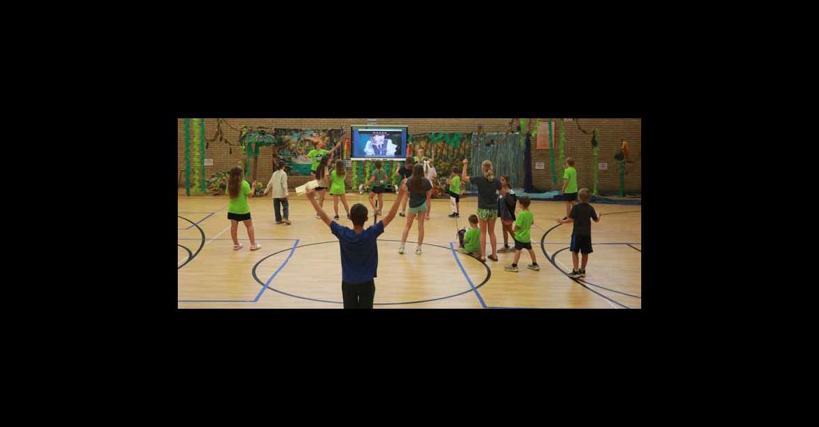 Youth participate in the song “God Is” June 2 during Ellsworth Community VBS in the Ellsworth Elementary School gym. Students participated in songs, games, bible adventures, sticky scriptures and other activities throughout the week. Photos by KAREN BONAR/Ellsworth County Independent-Reporter