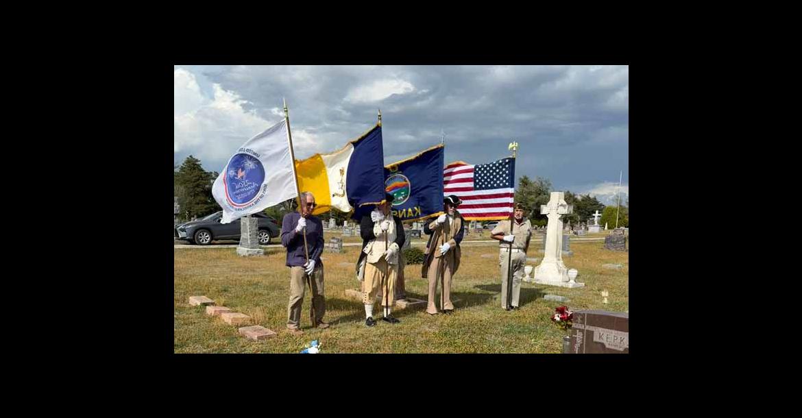 A variety of flags flap in the wind April 11 during the first Gold Star Mother ceremony at St. Wenceslaus Cemetery, Wilson. Pictured, from left, are Ron Svaty, John Moore, Bobbie Hulse and Doug Stefek. Courtesy photos