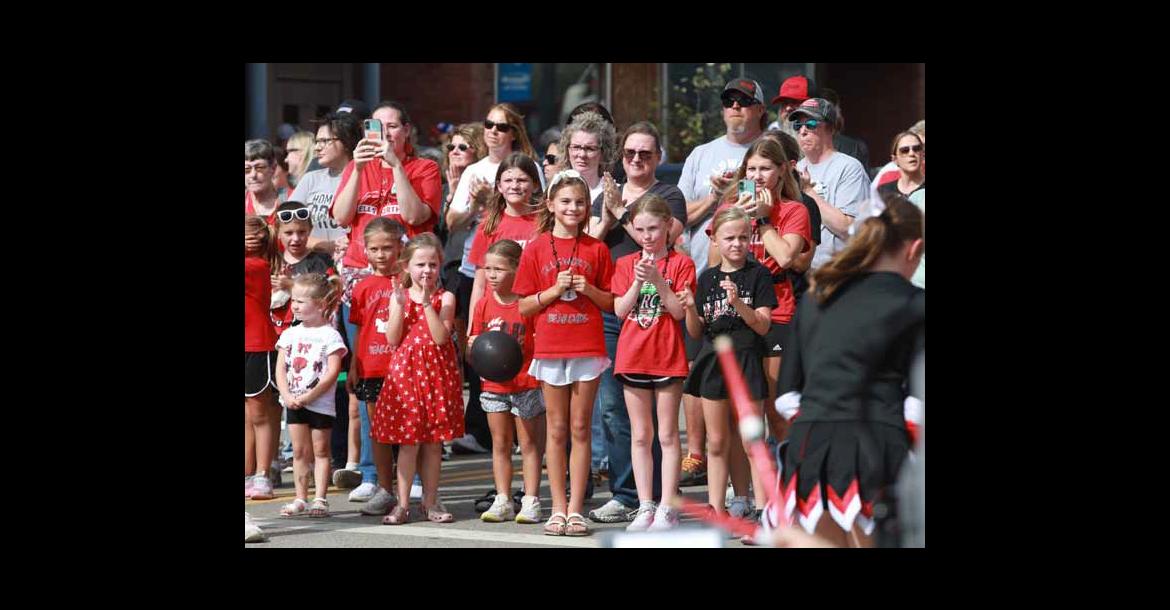 The crowd gathers at Douglas Avenue and East 1st Street while the homecoming candidates are introduced.