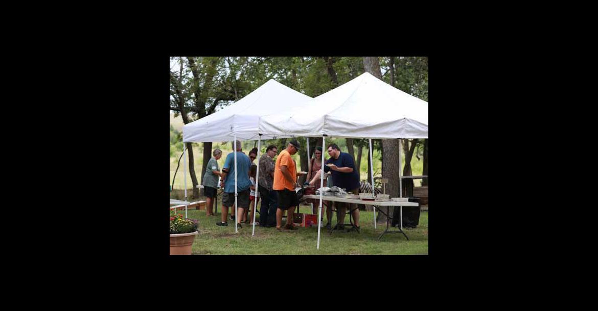Visitors fill their plates for lunch Sept. 6 at the Lorenz Picnic in rural Ellsworth County. KAREN BONAR/Ellsworth County Independent-Reporter