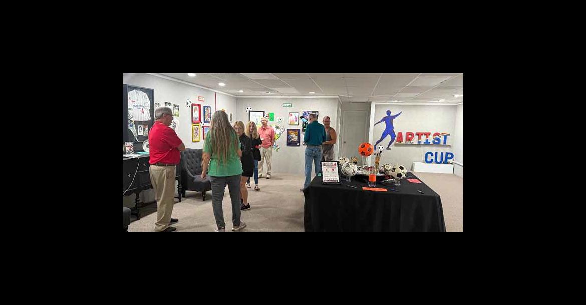 Crowds visit the gallery June 20 to view the art, soccer memorabilia and cast their votes for winners of The Artist Cup. Courtesy photos