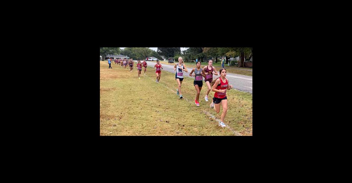 Freshman Mazie Barta leads the pack at the Hesston Invitational Sept. 10. She set a PR during the race. ERIC COONROD/Ellsworth County Independent-Reporter