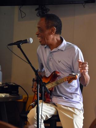 Acclaimed blues artist James Armstrong talks to the crowd while presenting a master class Saturday afternoon at the Roots & Blues Festival in T he Barn at the Midland Railroad Hotel.