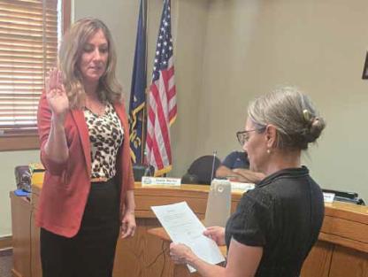 New Ellsworth City Administrator Emily Burns, left, is sworn in Monday by City Clerk Louise Ranker. RUSS ALLEN/Courtesy photo