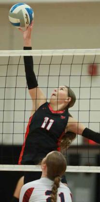 Senior Sydney Soukup attempts to block a shot during game one against Minneapolis Sept. 29. KAREN BONAR/Ellsworth County Independent-Reporter