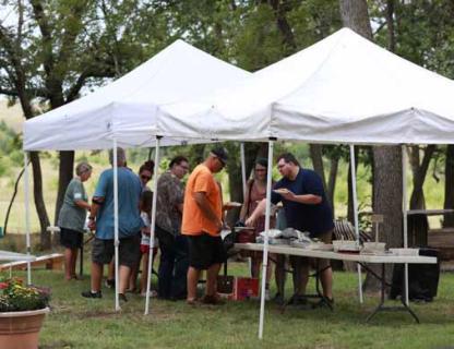 Visitors fill their plates for lunch Sept. 6 at the Lorenz Picnic in rural Ellsworth County. KAREN BONAR/Ellsworth County Independent-Reporter