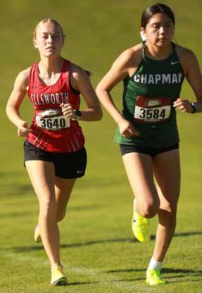 Senior Molly Ehrlich, left, starts the race strong on the Ellsworth Golf Course Oct. 6.