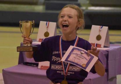 Ripley Kepka celebrates as she’s recognized as the 2026 Reading Grand Champion and winner of the Claudia Patry Reading Award. In addition to the medal, certificate and trophy, her name is engraved on the plaque honoring each year’s winner. CATHERINE DOUD/Ellsworth County Independent-Reporter