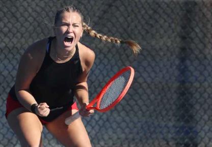 Makenna Anderson celebrates during the state tennis tournament in Topeka. Anderson and her doubles partner, Reygan Coonrod, placed second. Courtesy photo