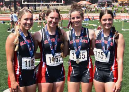 The girls’ 4x100-meter relay team of, from left, Kinly Place, Kari Place, Lainey Peschka and Kathryn Buggeln, celebrate a fifth place finish. The team also set a new school record for the race. Photos by jeremy obermeyer/Ellsworth County Independent-Reporter