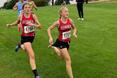 Lakyn Beckman, left, and Molly Ehrlich compete at Dodge City during the regional cross country meet. Beckman placed fourth to Ehrlich’s third-place finish. Courtesy photos